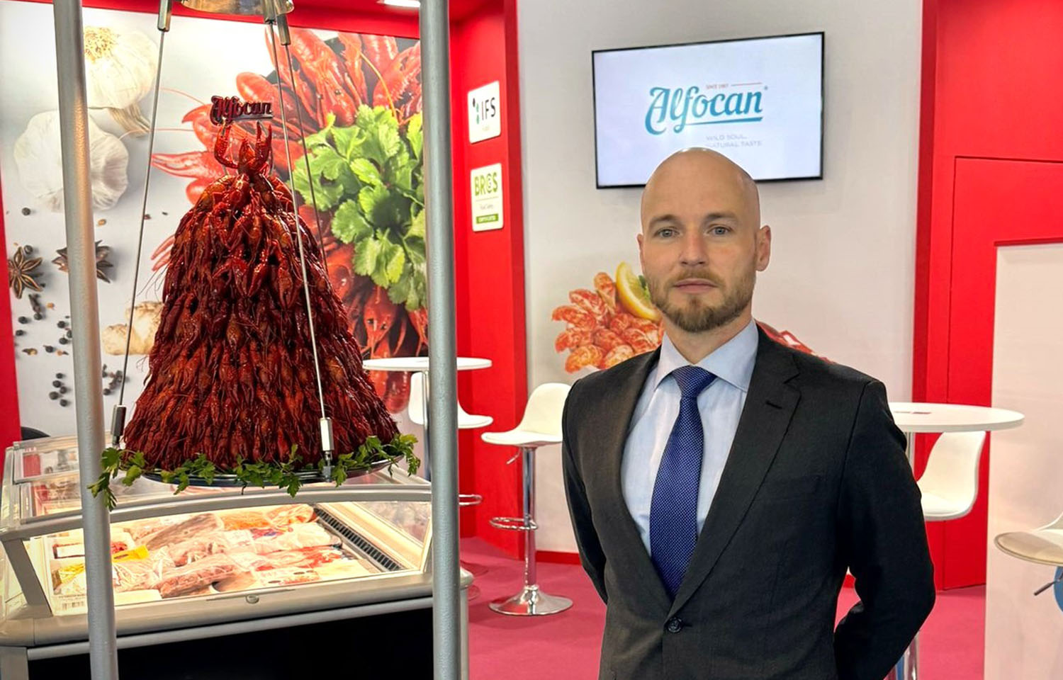 Alfocan General Manager Nicolas Roux standing in the company's booth at Seafood Expo Global