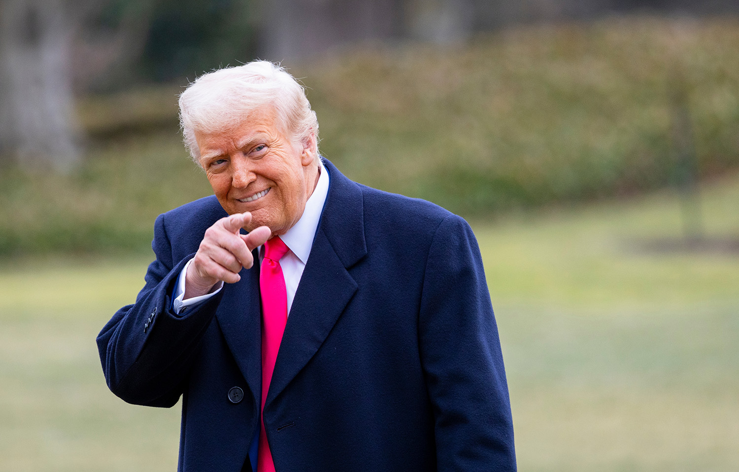 U.S. President Donald Trump smiling and pointing