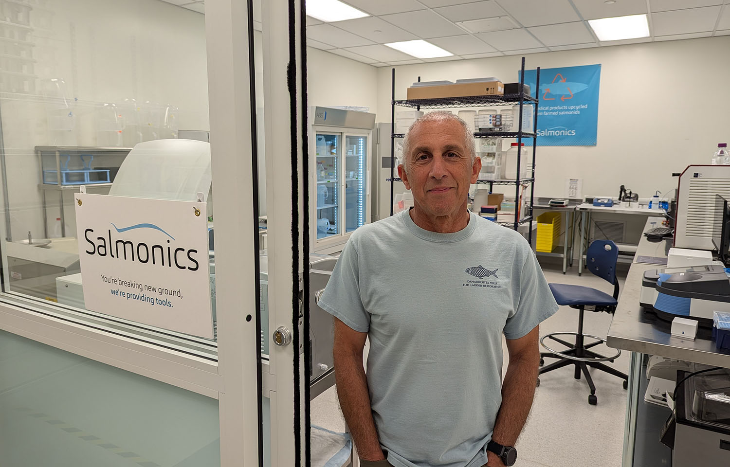 Salmonics President and CEO Cem Giray standing in the doorway of the company's laboratory