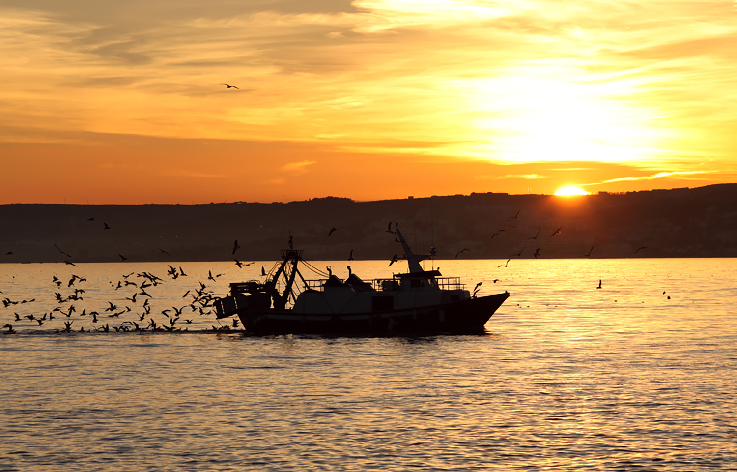 A fishing vessel out on the water in Andalusia, Spain