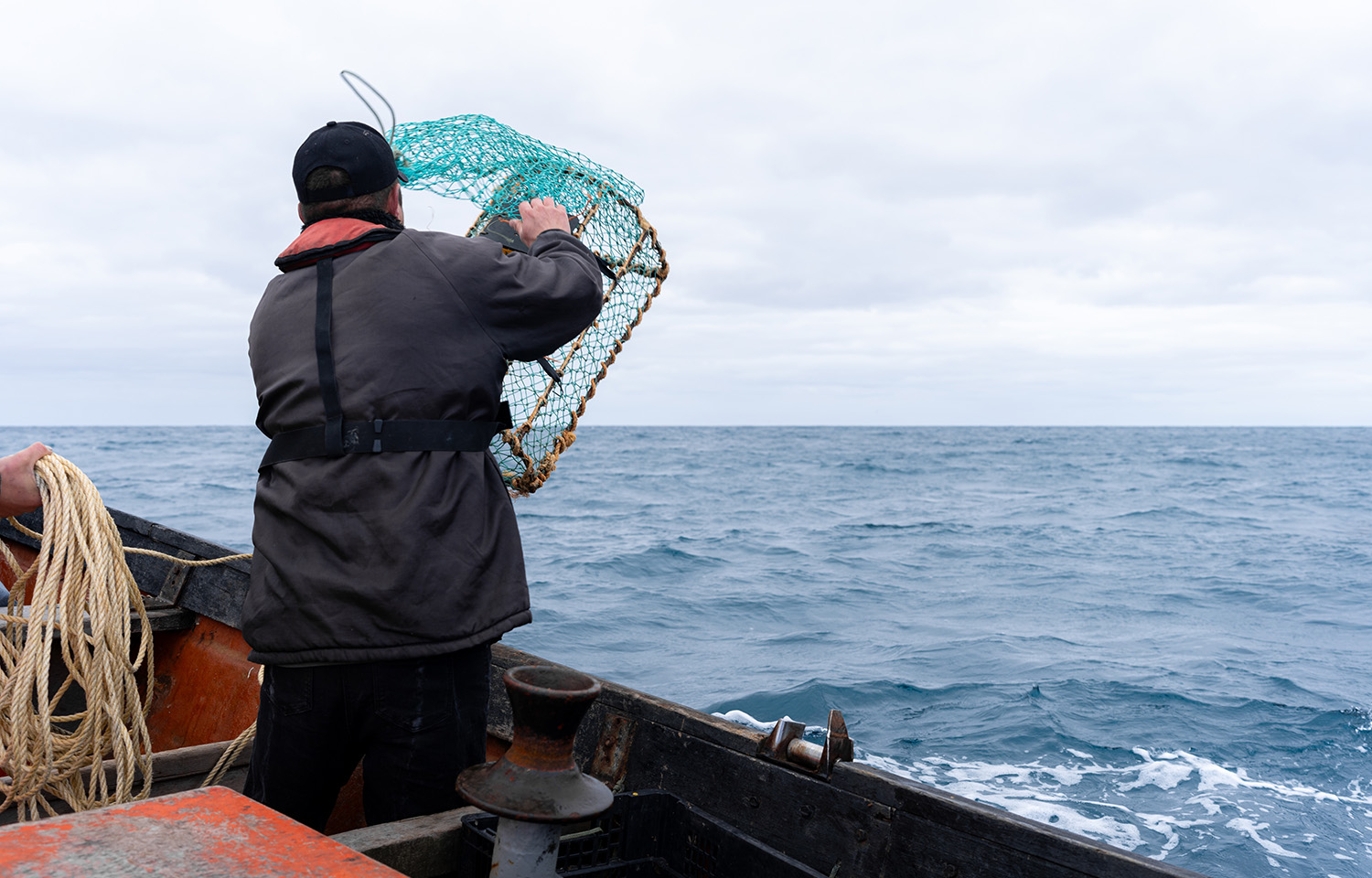 A lobster fisherman onboard a vessel