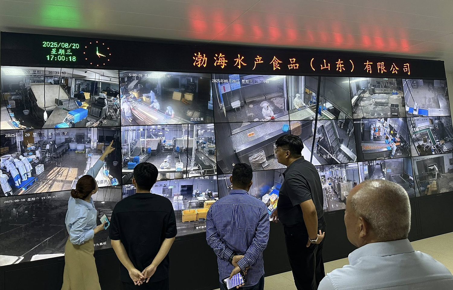 Heifer employees being shown surveillance of the Bohai Aquatic Foods shrimp-farming and -processing operation in Shandong Province