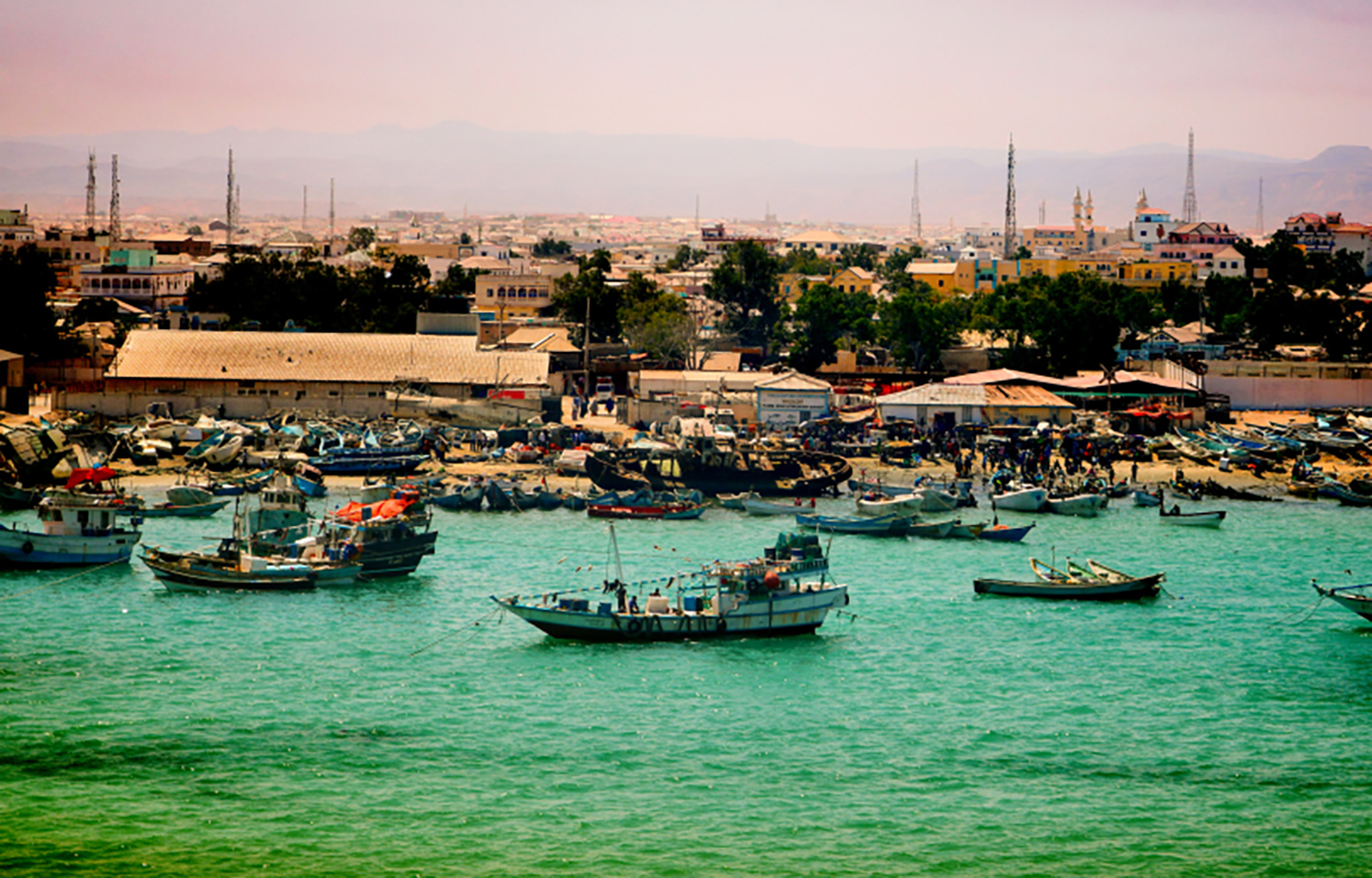 Fishing boats weaving through the busy port of Bosaso in Somalia