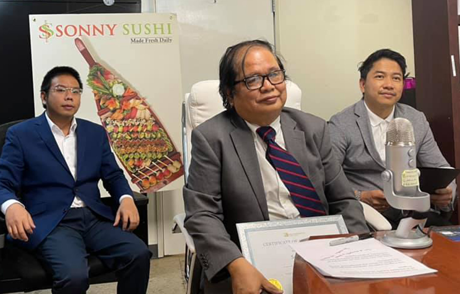 Sonny Sushi Owner Sann Ni (center)