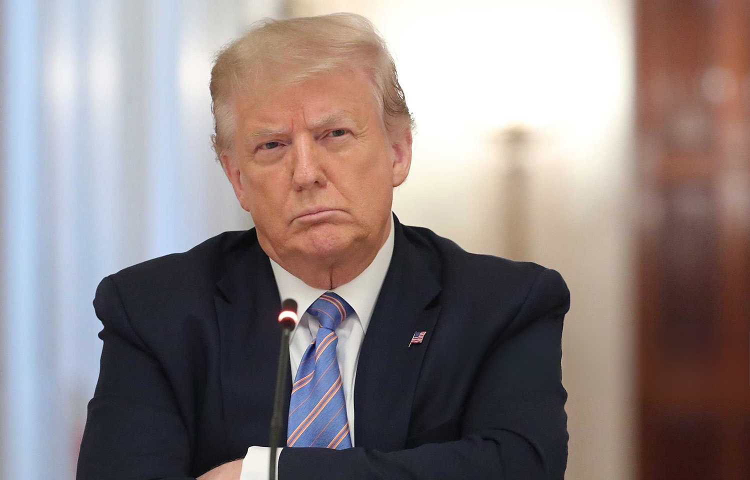 U.S. President Donald Trump with his arms crossed