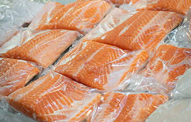Packages of Norwegian salmon in plastic