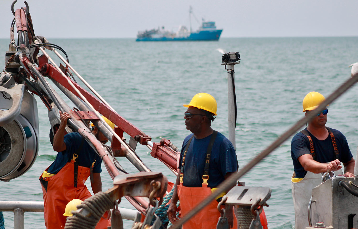 An Ocean Harvesters employee on a fishing vessel