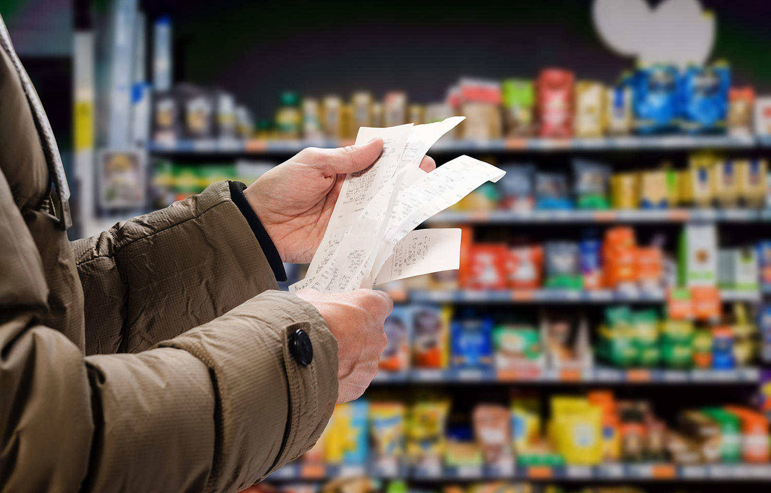 A shopper looking at receipts
