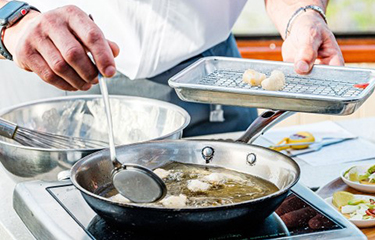 A chef prepares BlueNalu's cell-based yellowtail .