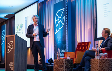 Ahold Delhaize Vice President of Product Integrity Hugo Byrnes hosting a panel at the Global Shrimp Forum.