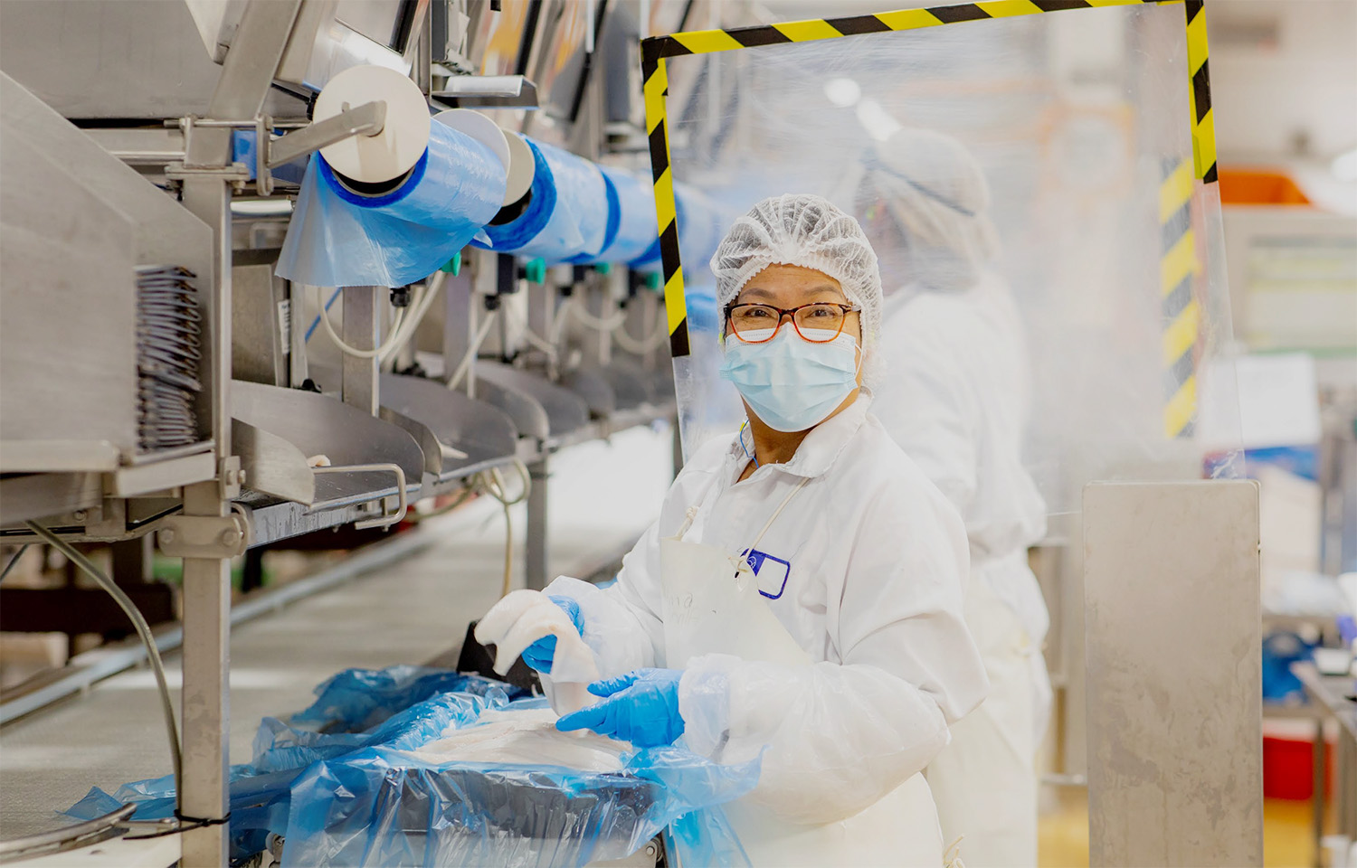 A worker inside a Sanford Limited processing facility