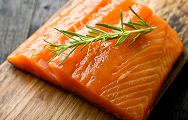 Salmon with rosemary on top.