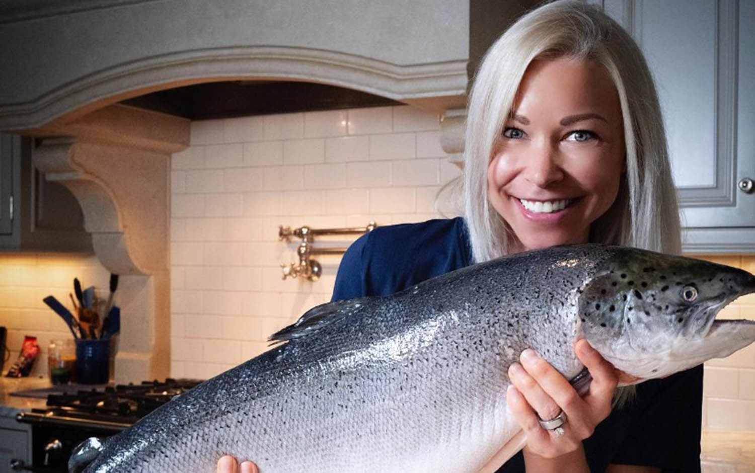 GiGi 'The Salmon Queen' holding salmon