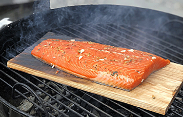 Farmed Atlantic almon on a barbeque.