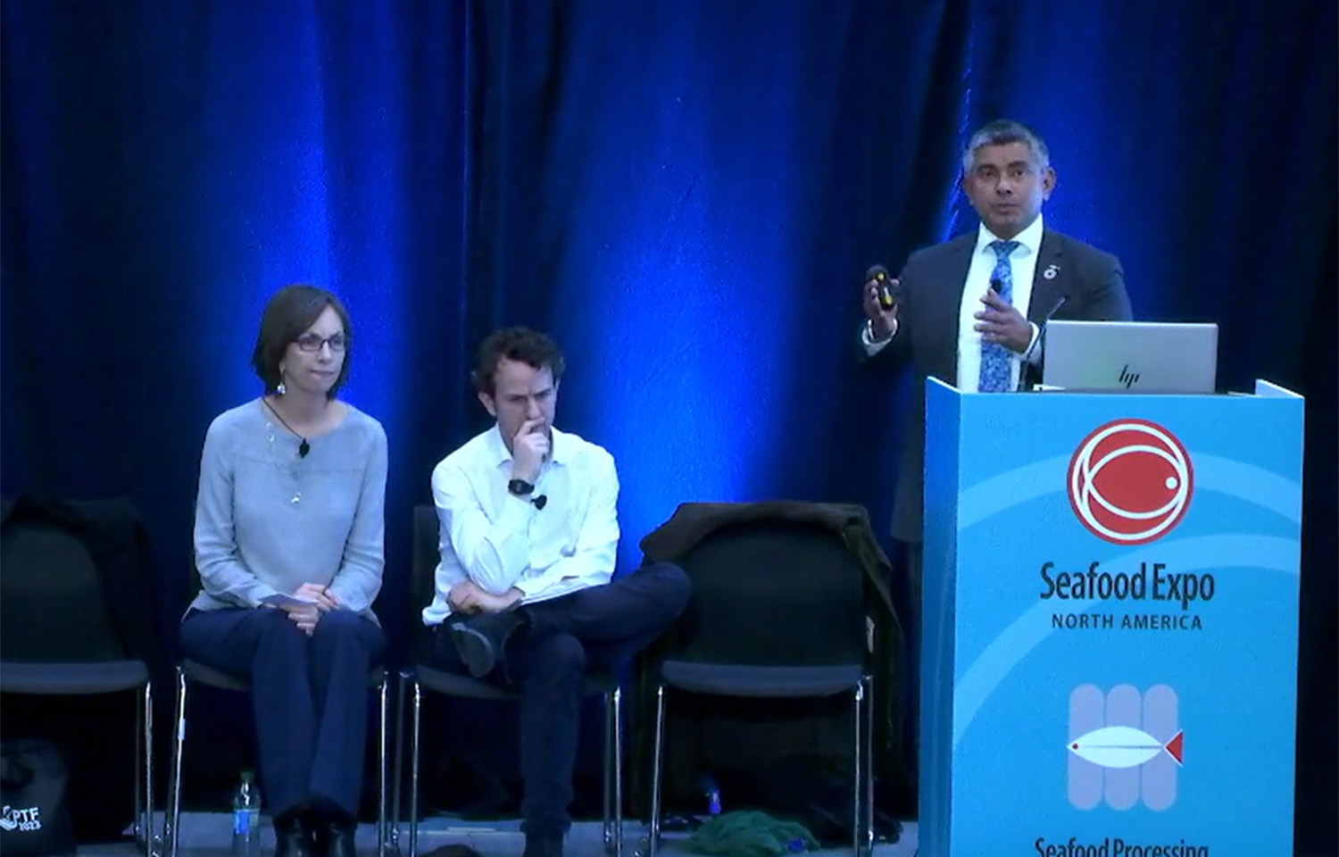 Panel members on stage at Seafood Expo North America
