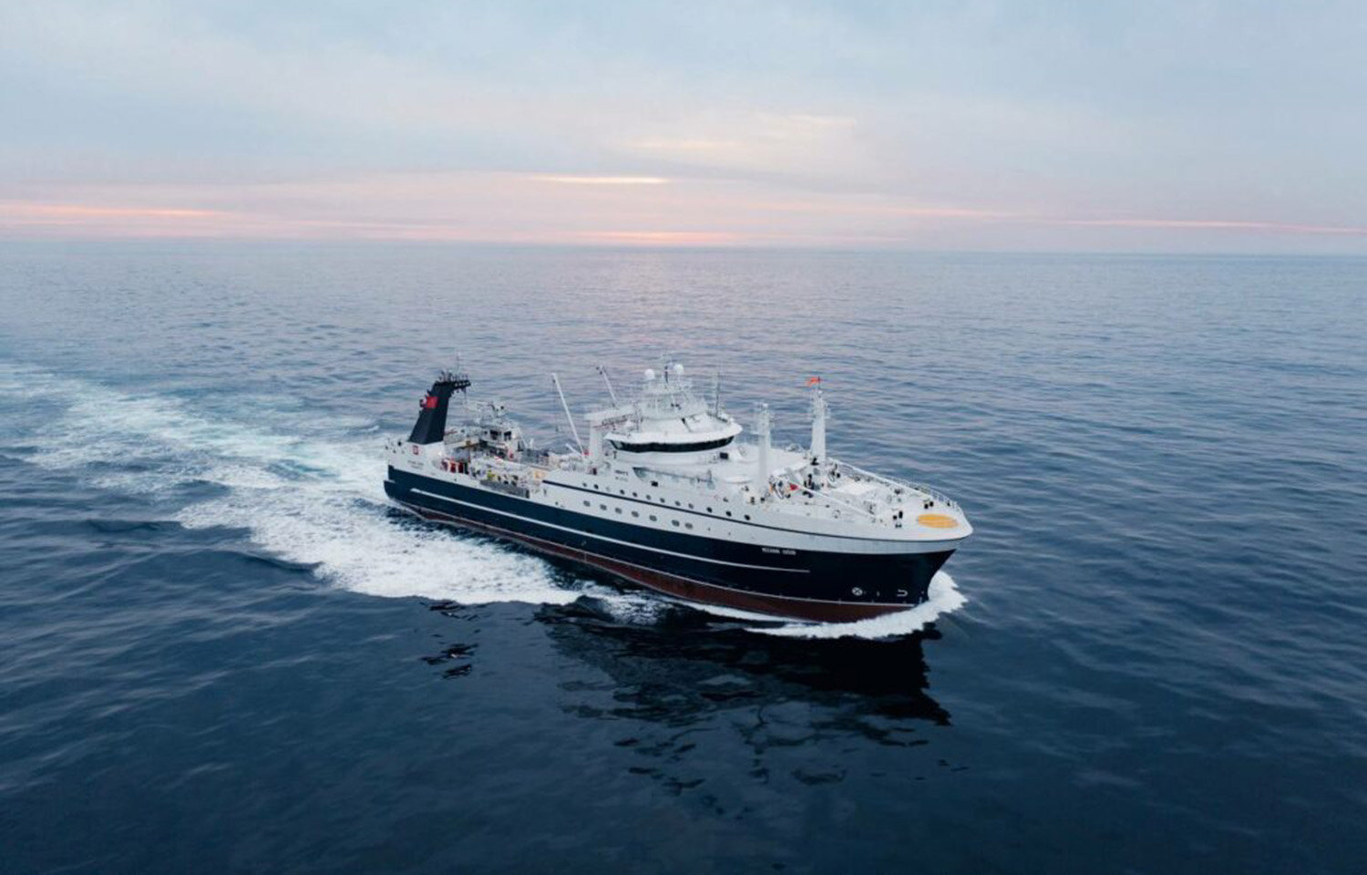 A Russian fishing vessel sailing on calm water