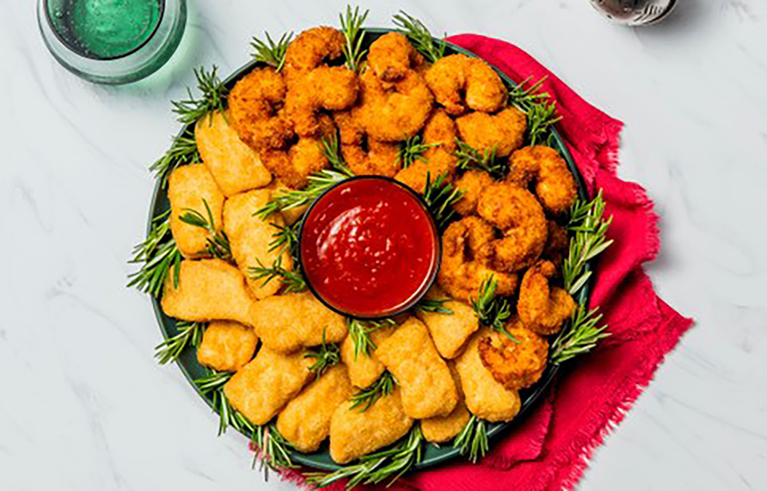 A wreath with shrimp and nuggets lining it