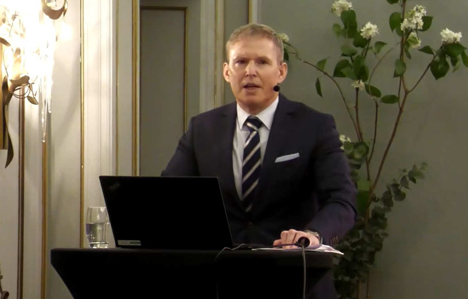 Mowi CEO Ivan Vindheim at a podium delivering the company's financial results