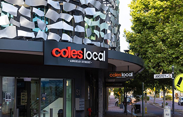 The exterior of a Coles grocery store chain.