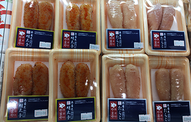 A selection of various mentaiko products by Yamaya Communications inside packaging.