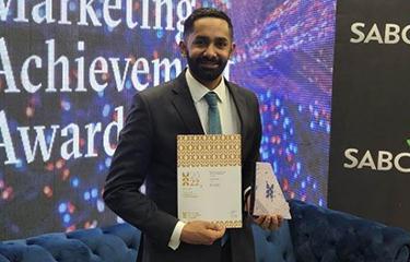 Sea Harvest Group Limited Head of Marketing Jared Patel receiving the Mondelēz 2022 Rising Star of the Year Award.