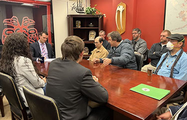 U.S. fishermen meet with a staff member from the office of U.S. Senator Lisa Murkowski.