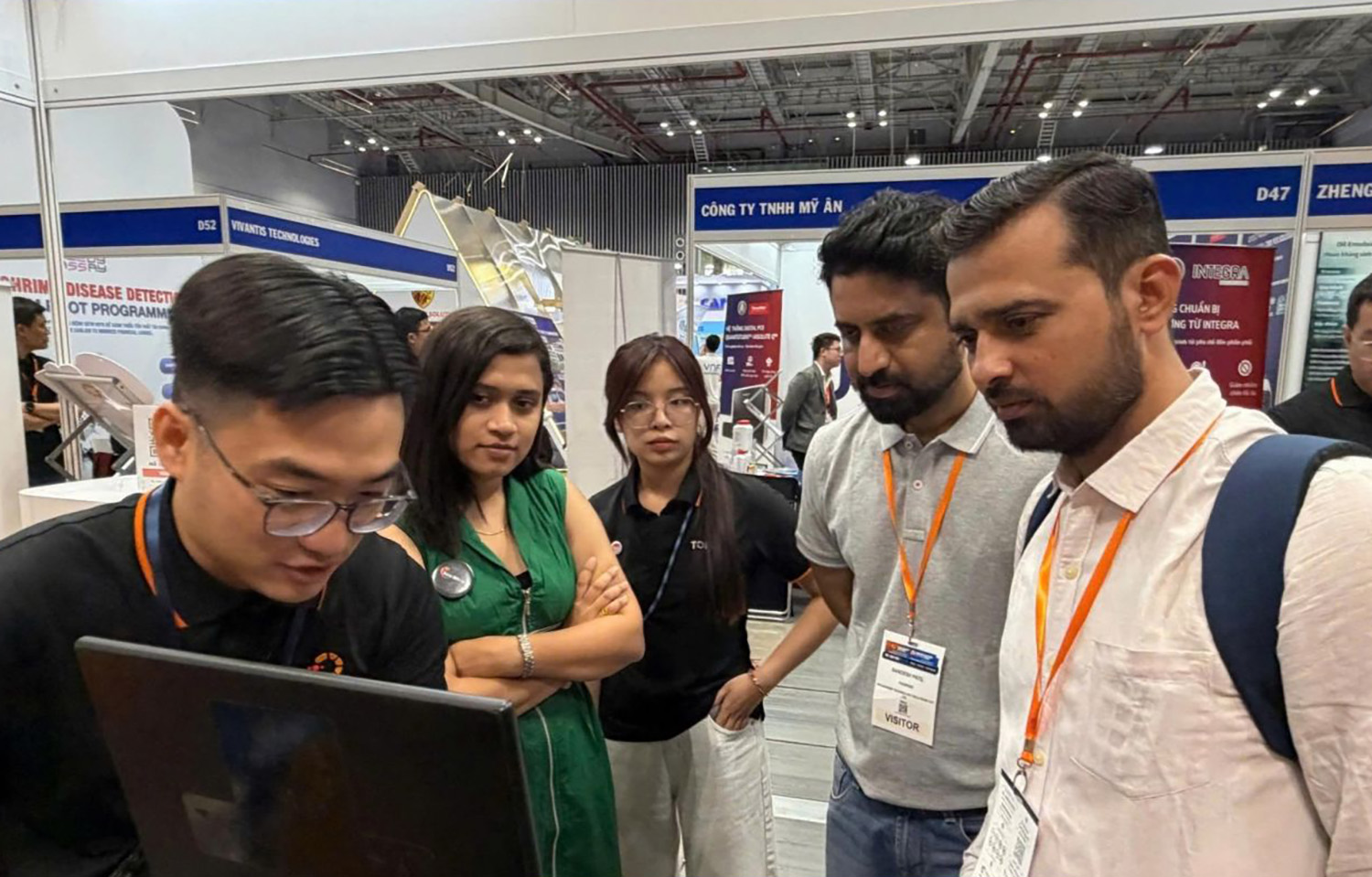 Otanics staff showing off the Tomota digital platform at the 2026 VietShrimp Asia and Aquaculture Vietnam show