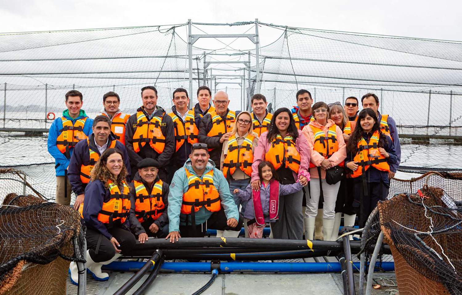 Tourists visiting an AquaChile salmon farm