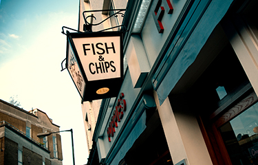 A sign outside Poppies, a U.K. chippie.