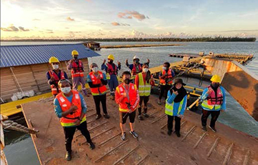 The staff of a Barramundi Group facility pose for a photo.
