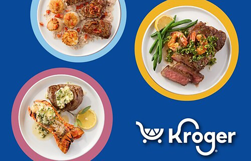 Plates with steak, lobster, and crab on them