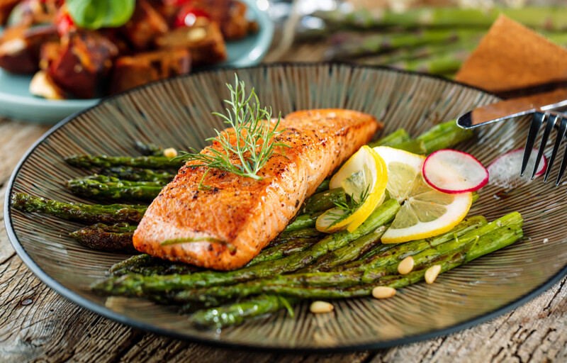 Salmon on a bed of asparagus