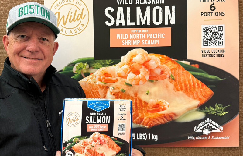 Keith Singleton holding up a box of the company's new salmon product