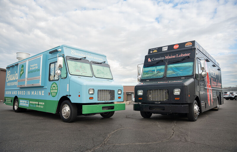 A Cousins Fried Seafood truck next to a Cousins Maine Lobster truck