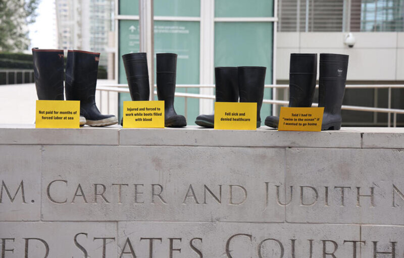 Fishing boots on top of a courthouse sign