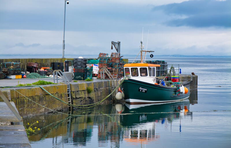 A fishing boat tied up in Ballyvaughan, Ireland