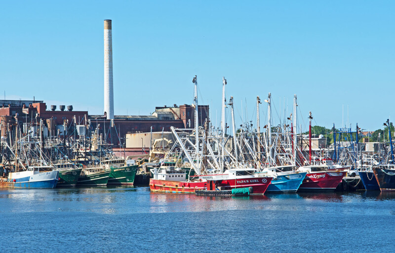 A group of fishing boats in the harbor in New Bedford