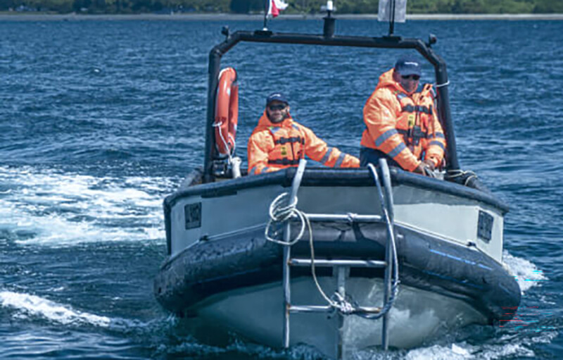 AquaChile employees on a boat
