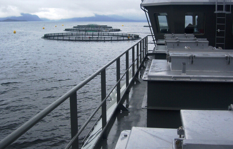 A AKVA Group vessel near some aquaculture net pens