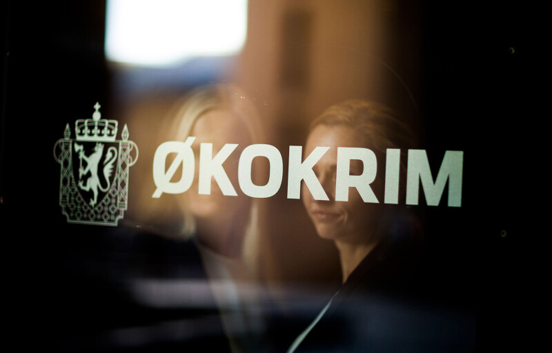 The Økokrim logo on a window