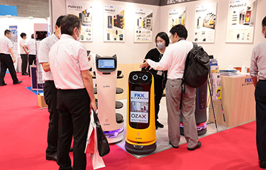 Column-shaped “robowaiters” made by Shenzhen, China-based Pudu Robotics.