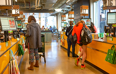 A check-out line at a Whole Foods store in the United States.