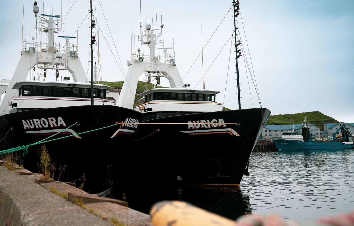 A pair of Alaska pollock fishing boats at a dock in Alaska