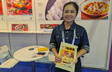 Guangdong Harmony Food Co Sales Director Fiona Wong holding one of the company's new retail snakehead products