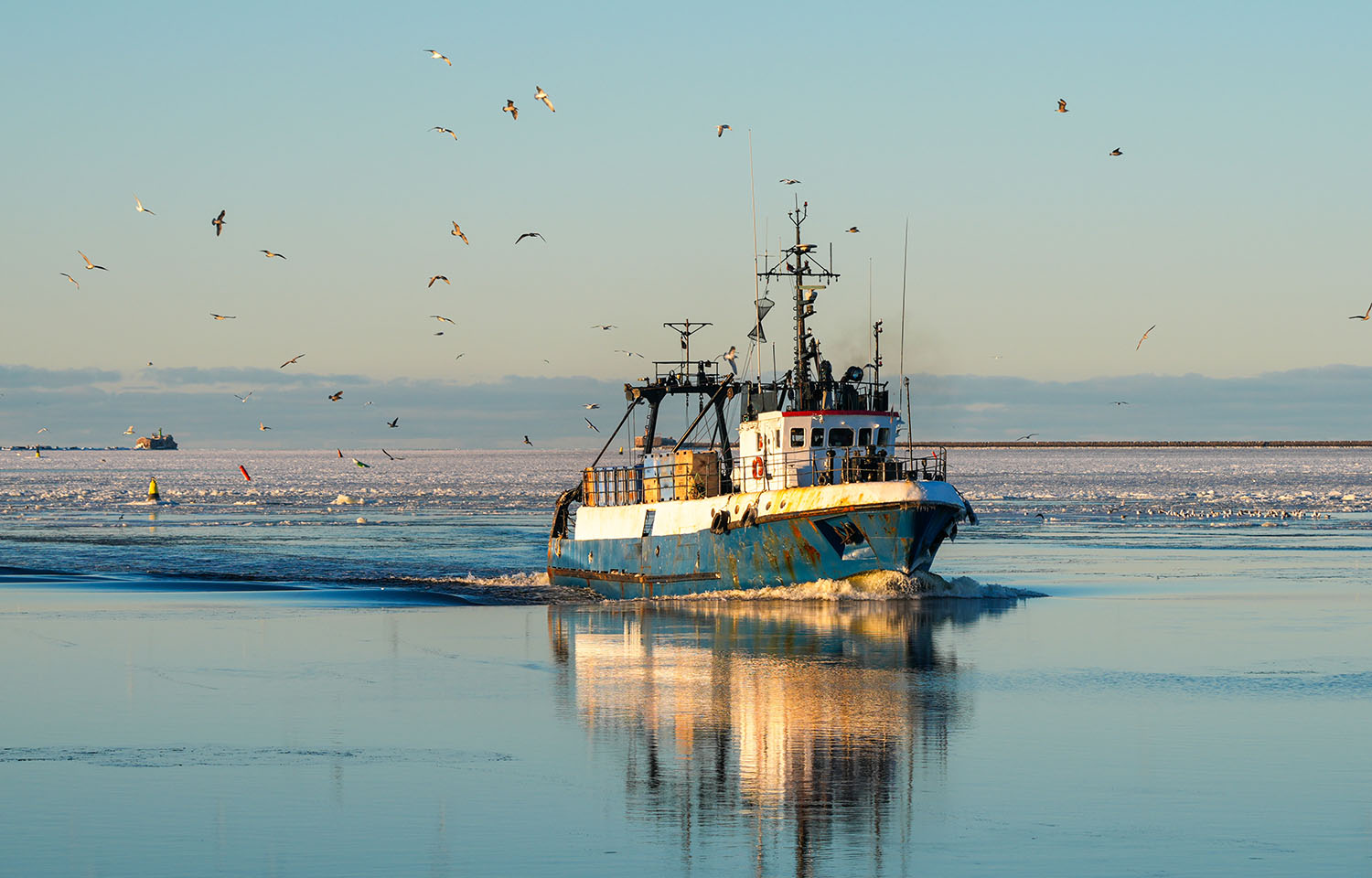 A fishing vessel in the Baltic Sea steaming toward a Latvia port