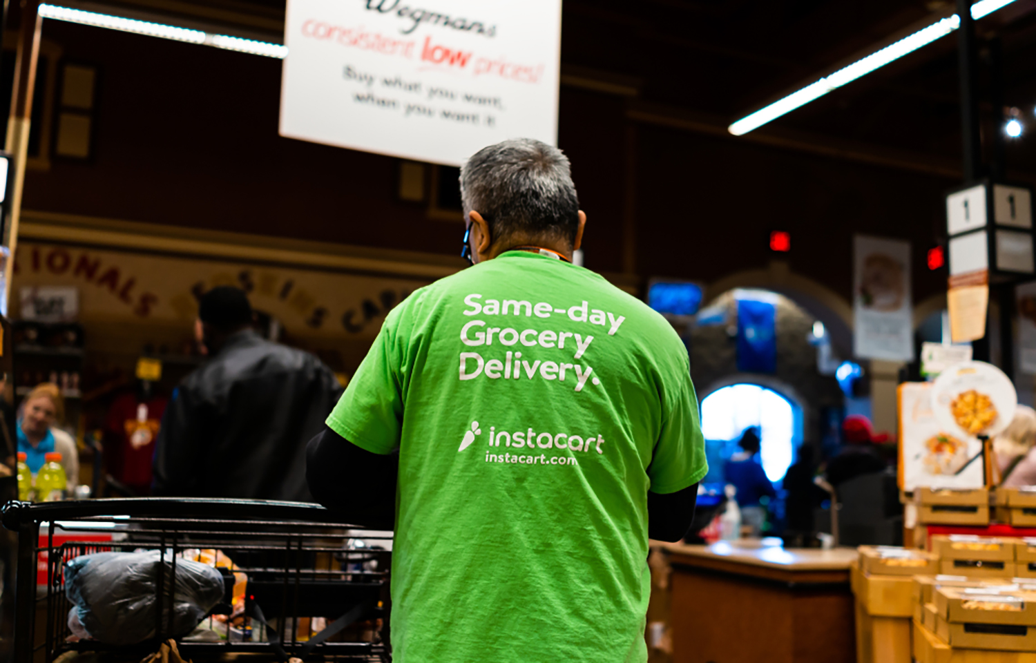 An Instacart shopper at a grocery store