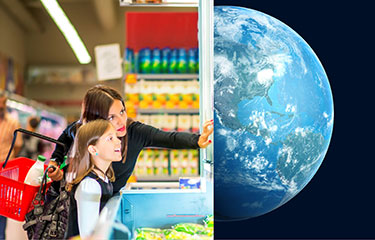 Mother and daughter looking at store display with the planet earth on the other side.
