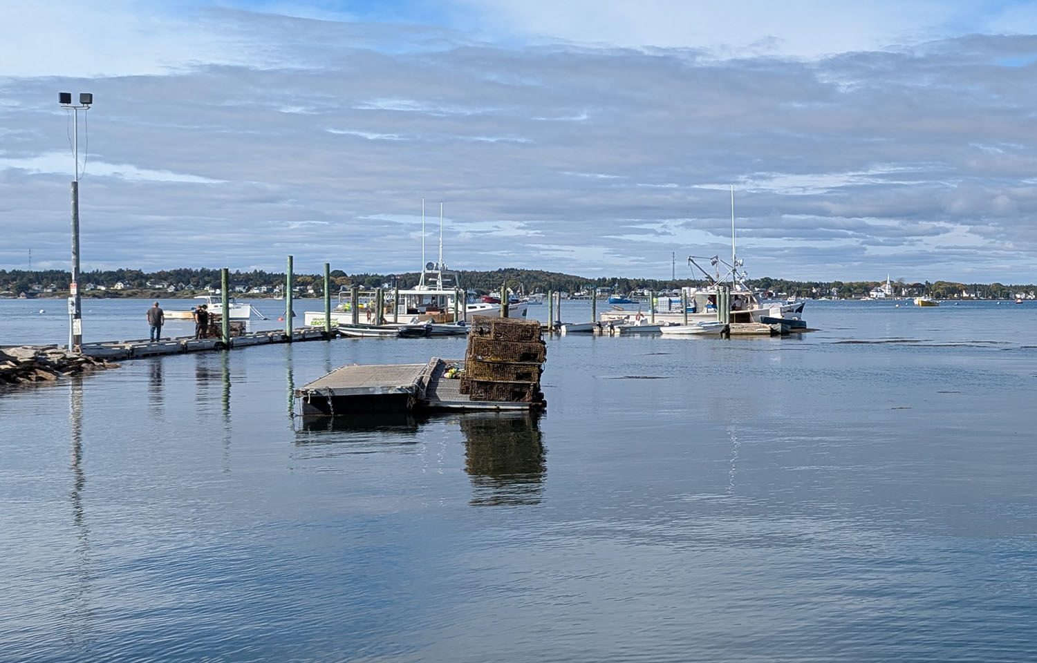 A harbor in Maine with two lobster boats
