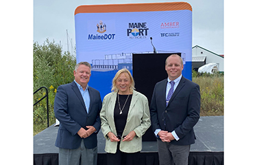 Officials, including Maine Governor Janet Mills, pose for a photo during the groundbreaking of a new cold storage facility.
