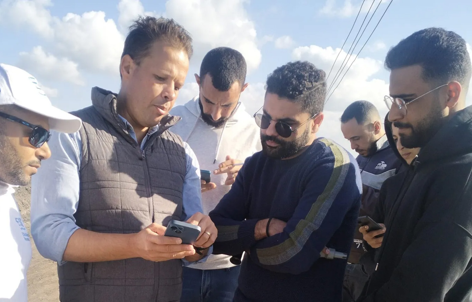 Egyptian farmers being trained on a tilapia welfare app that collects real-time data on farm performance